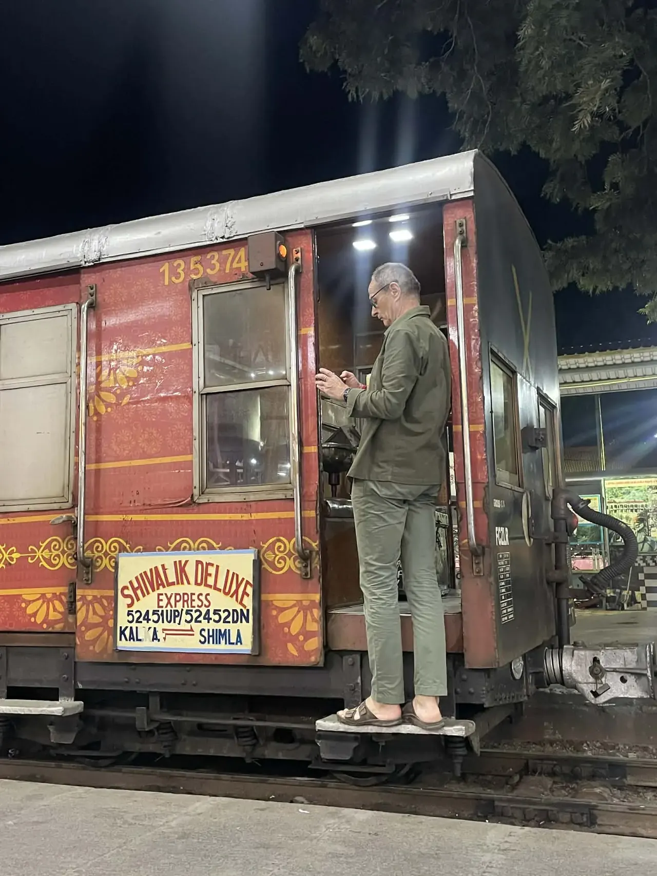 Kalka-Shimla toy train halted at a hill station platform at night, UNESCO heritage railway tour