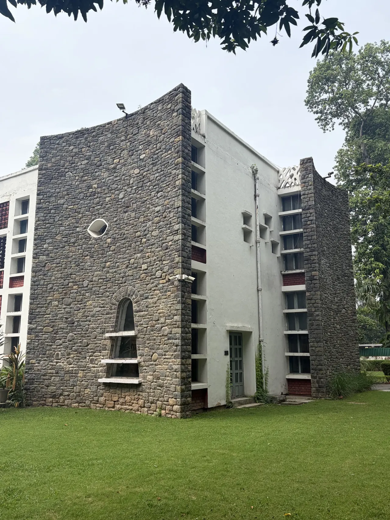 Maison Jeanneret exterior multi-storey stone facade, Chandigarh Le Corbusier-era architecture tour