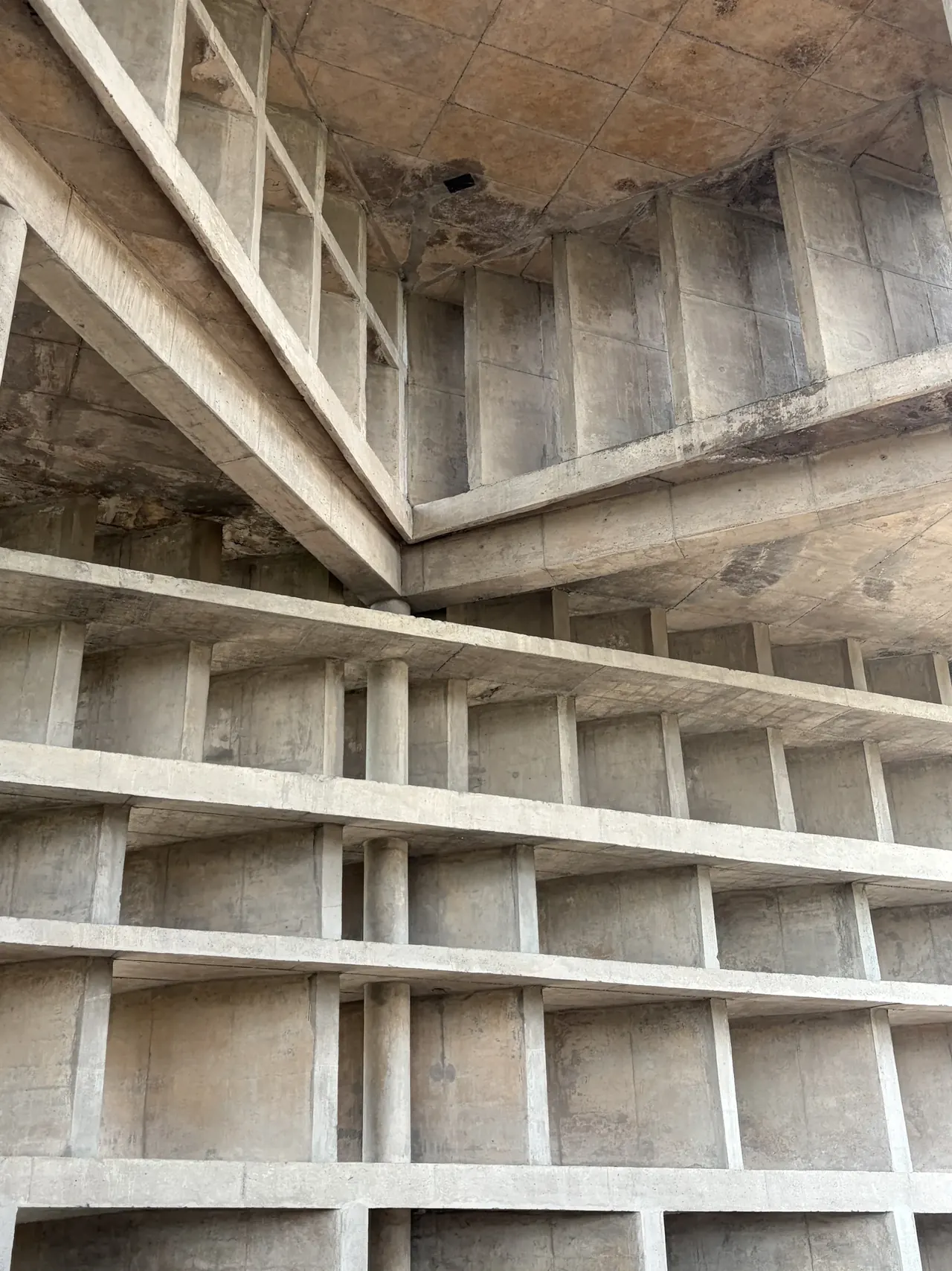 Weathered concrete ceiling corner detail inside Tower of Shadows, Chandigarh Le Corbusier design tour
